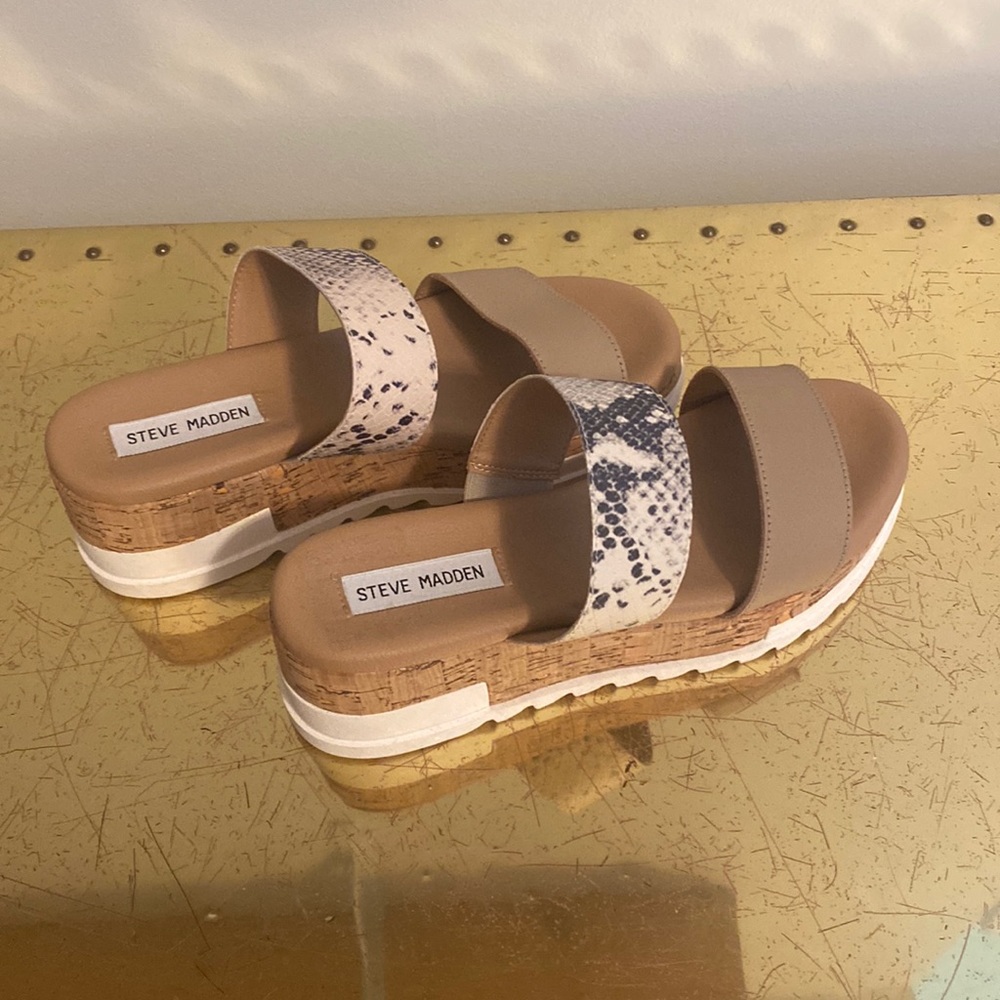 Size 7 womens. In new condition, never worn. Sticker residue shown in photo
